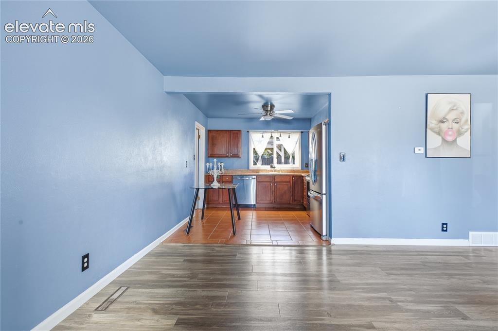 Image 4 of 24: BRIGHT, OPEN LIVING SPACE FEATURING LARGE WINDOWS