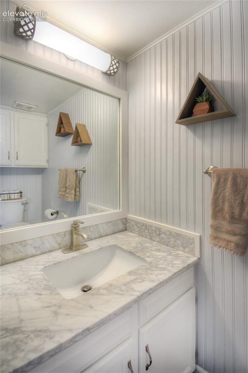 Image 14 of 26: 1/2 bath on main level.