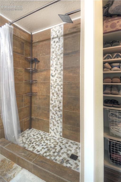 Image 18 of 26: Primary bathroom shower.