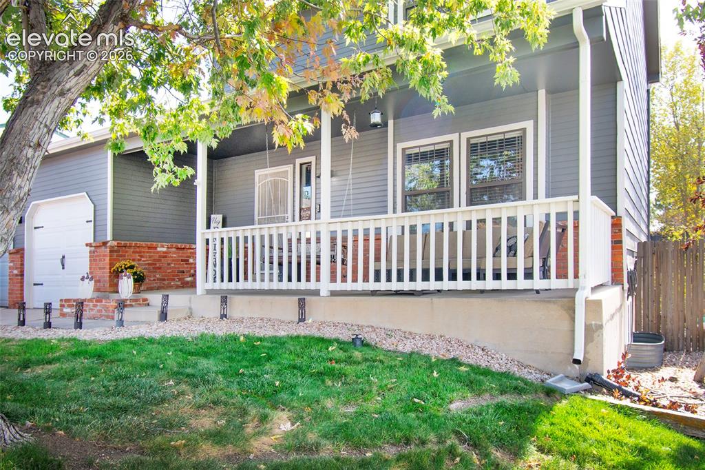 Image 2 of 26: Inviting front porch with Mountain Views!