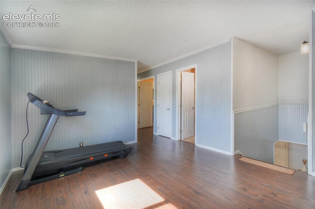 Image 22 of 26: Choose how to furnish the open upper level space as a office, playroom area