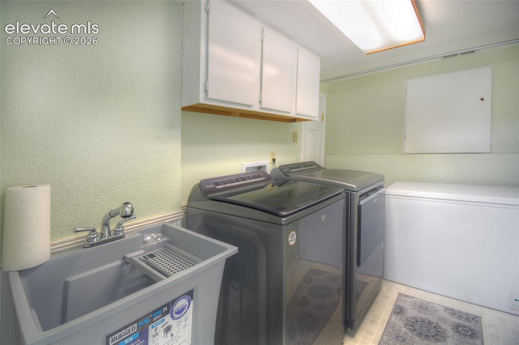 Image 23 of 26: Dedicated laundry room to include a utility sink!