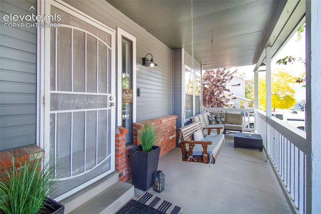 Image 4 of 26: The charming covered front porch is the perfect spot to sip morning coffee