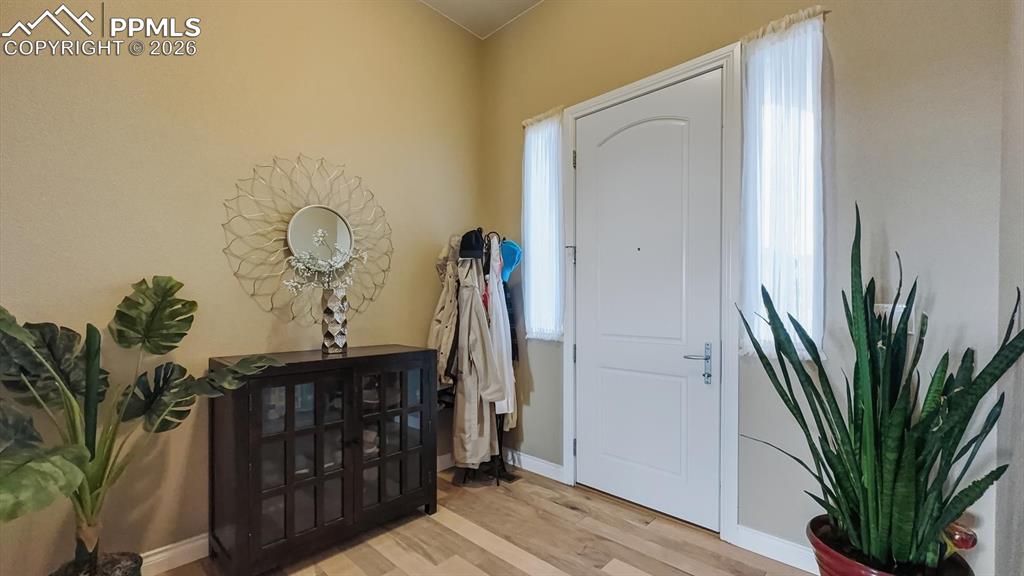 Image 13 of 50: Front Entry with gleaming hardwood floors.