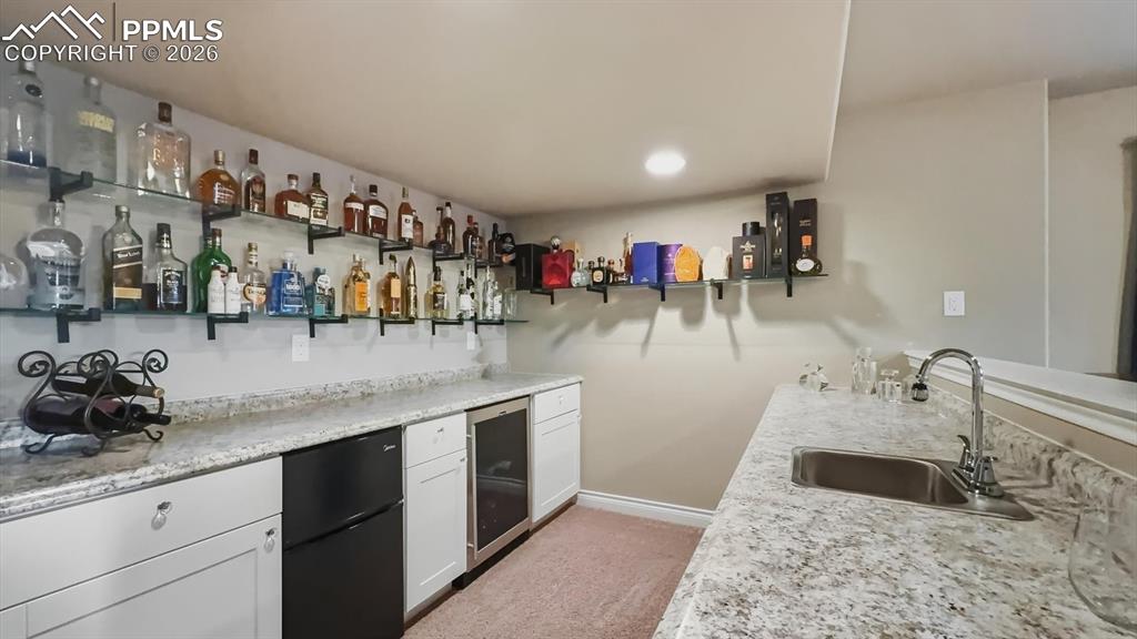 Image 36 of 50: The Basement wet bar is the perfect place for serving your favorite beverag