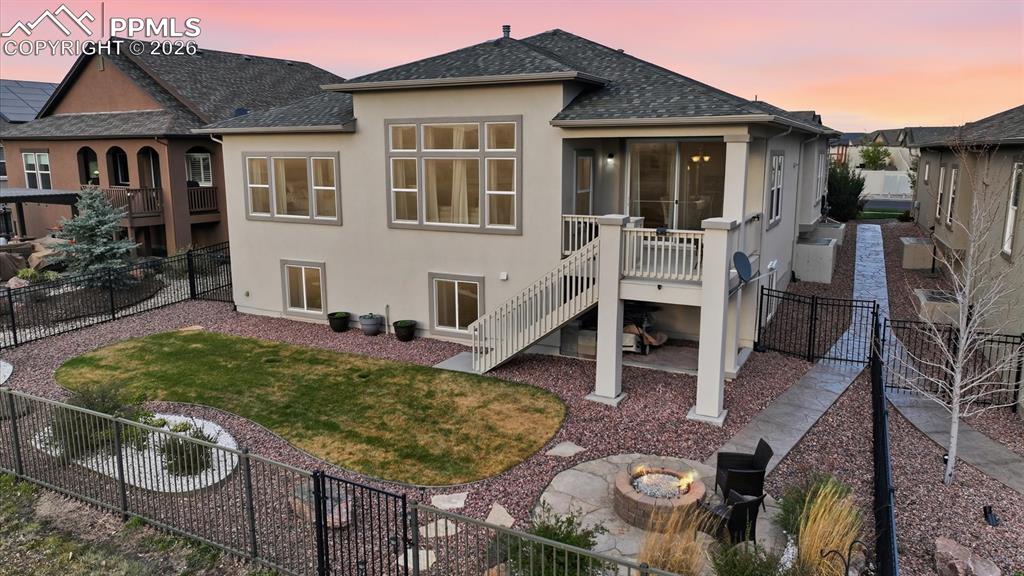 Image 47 of 50: Aerial view of backyard and rear view of home.