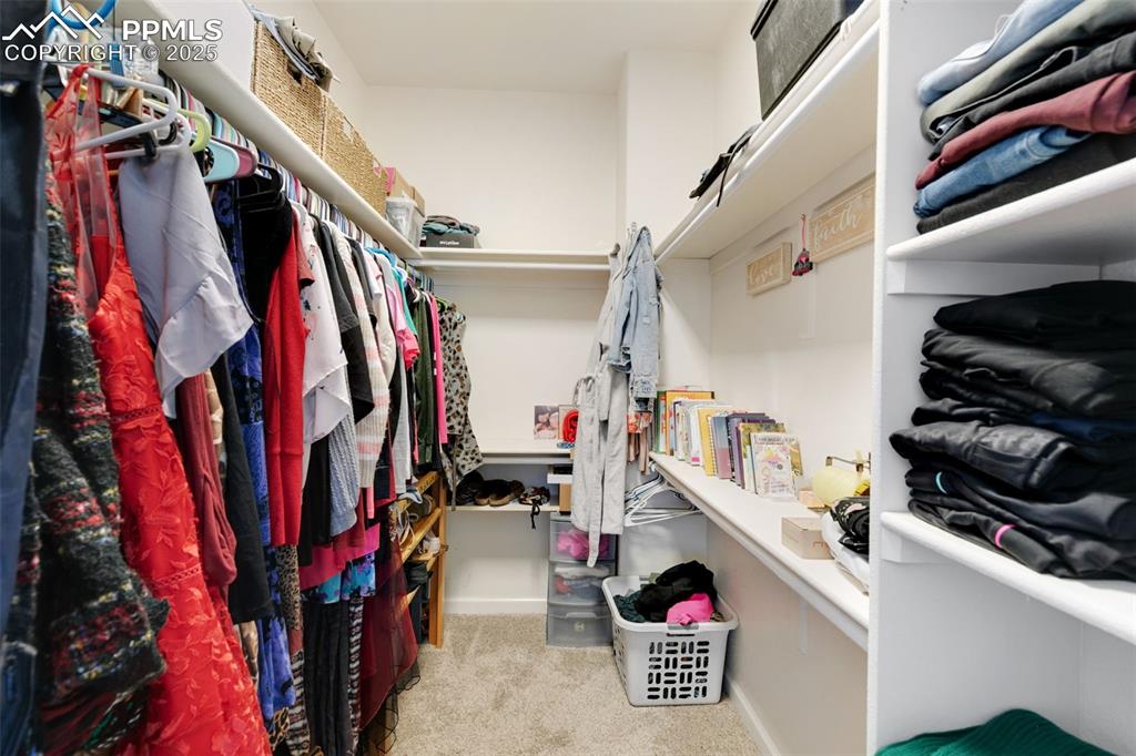 Image 19 of 41: Primary walk-in closet