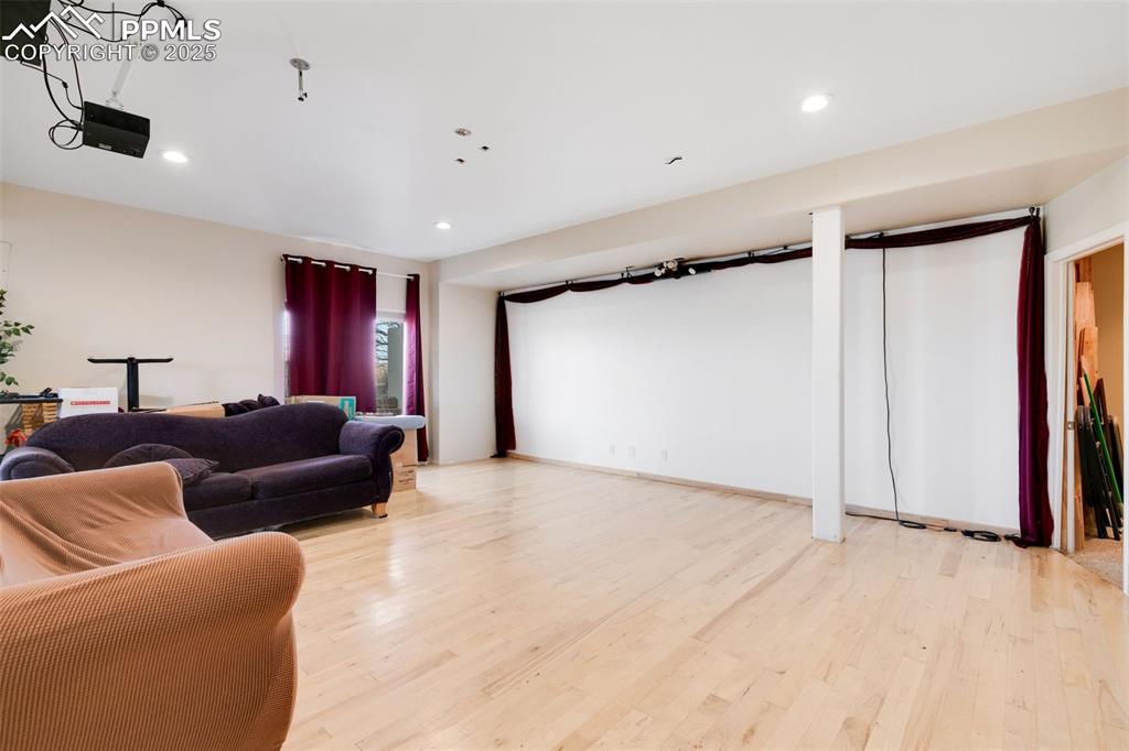 Image 23 of 41: This space has a raised, maple floating floor for dancing.