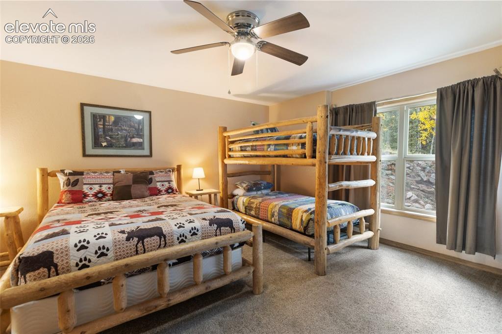 Image 30 of 50: Recessed window with trim, light-colored walls, and a ceiling fan with inte