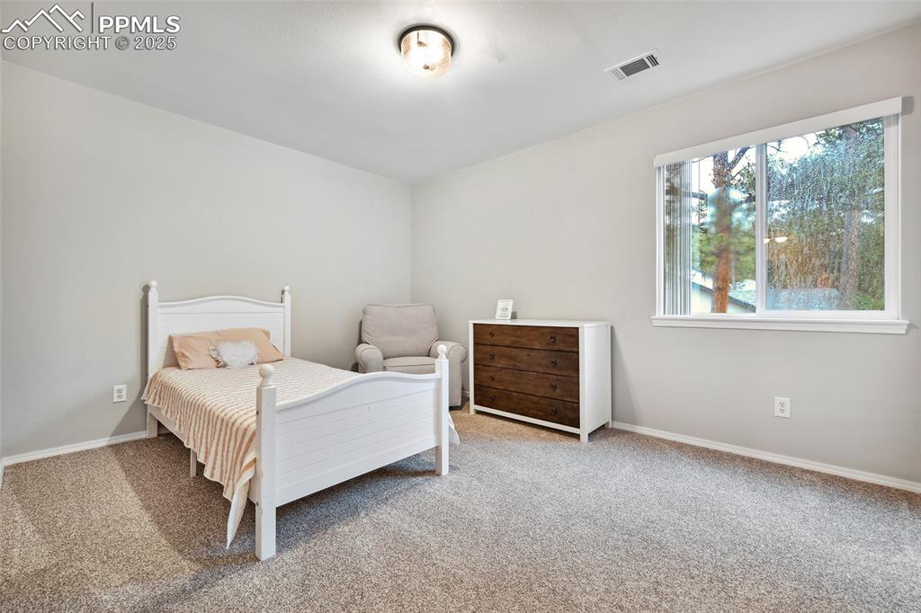 Image 25 of 47: Bedroom featuring carpet flooring and baseboards