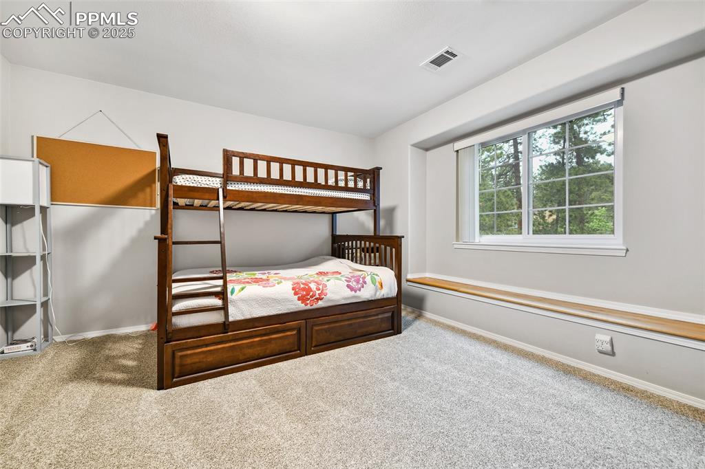 Image 27 of 47: Carpeted bedroom featuring baseboards
