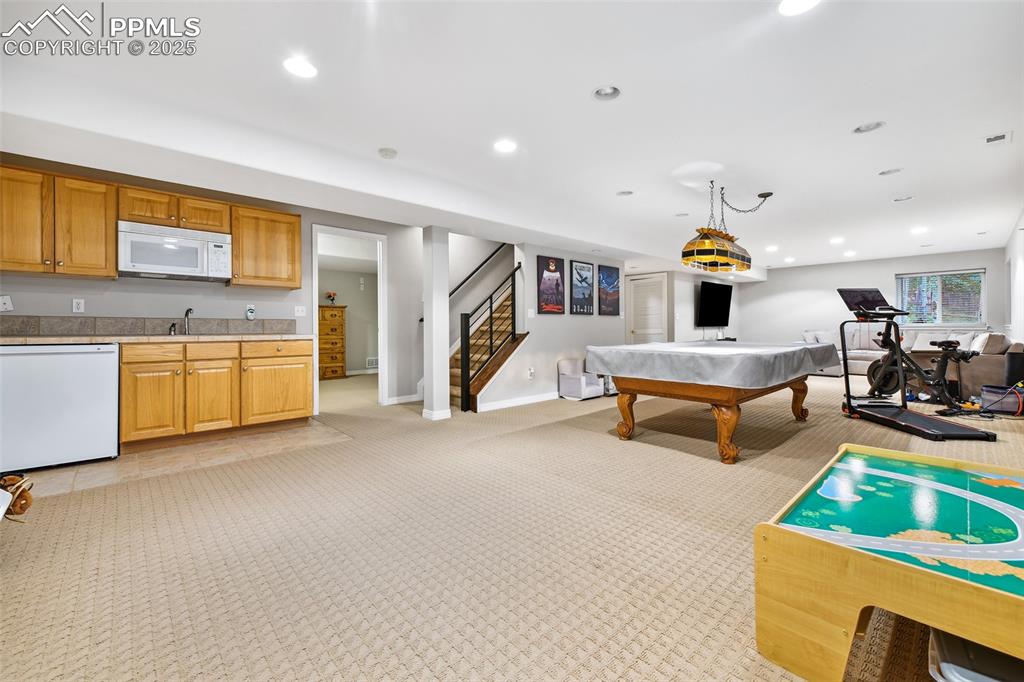 Image 29 of 47: Playroom featuring billiards, light carpet, and recessed lighting