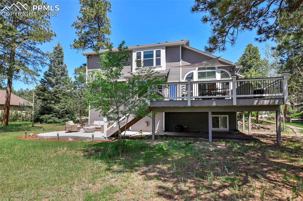 Image 39 of 47: Rear view of property with a deck, a patio area, an outdoor living space, s