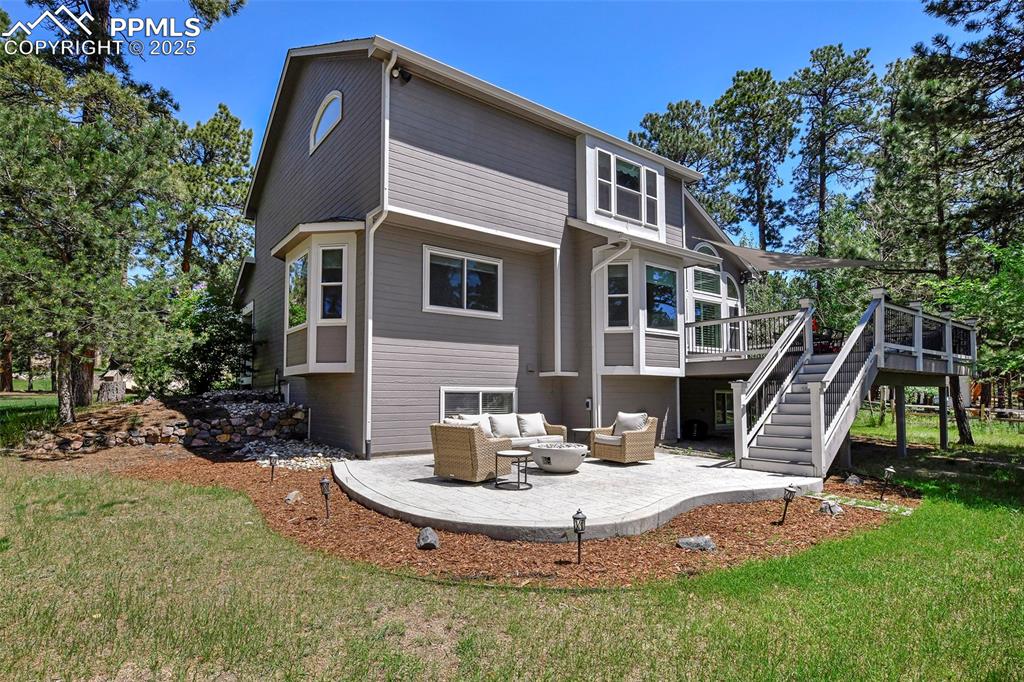 Image 45 of 47: Rear view of property with a patio area, an outdoor hangout area, stairway,