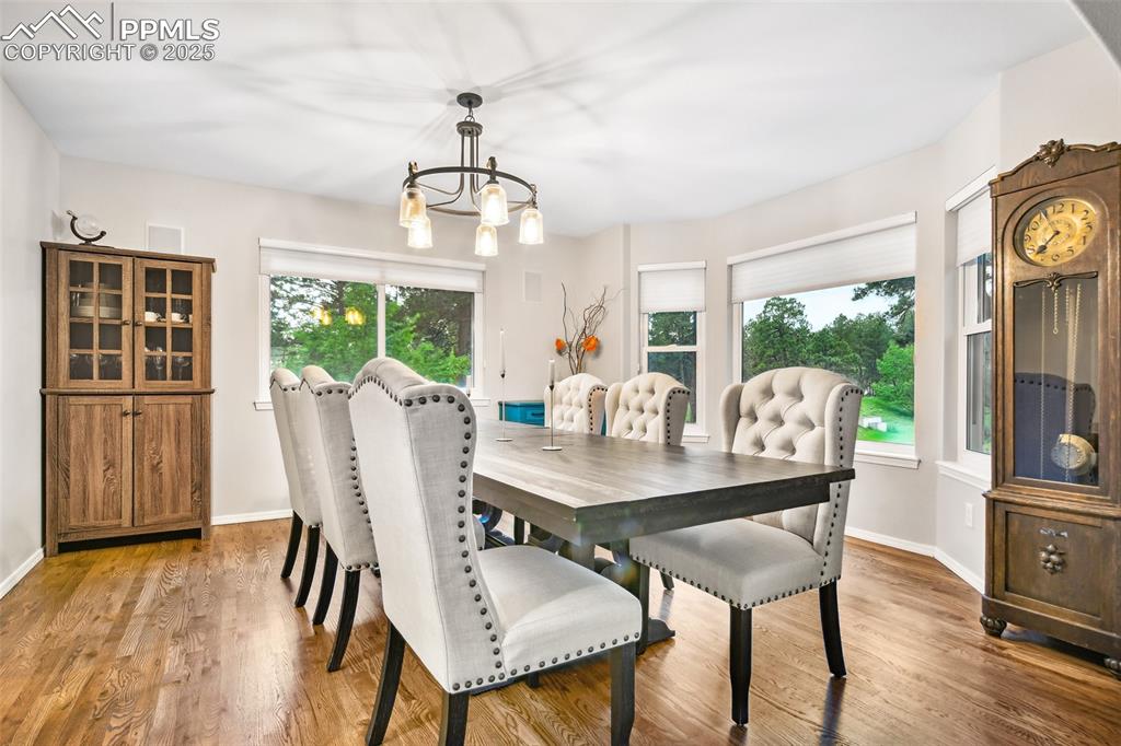 Image 9 of 47: Dining room with light wood-type flooring