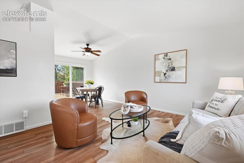 Image 11 of 32: Another view of the open floor plan and vaulted ceiling!