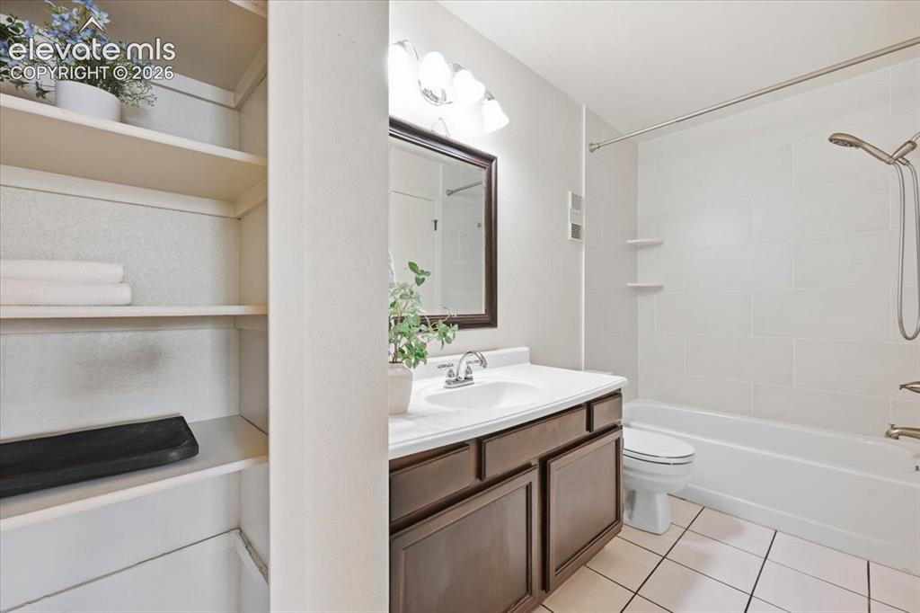 Image 20 of 32: Main level shared master bath with linen closet!