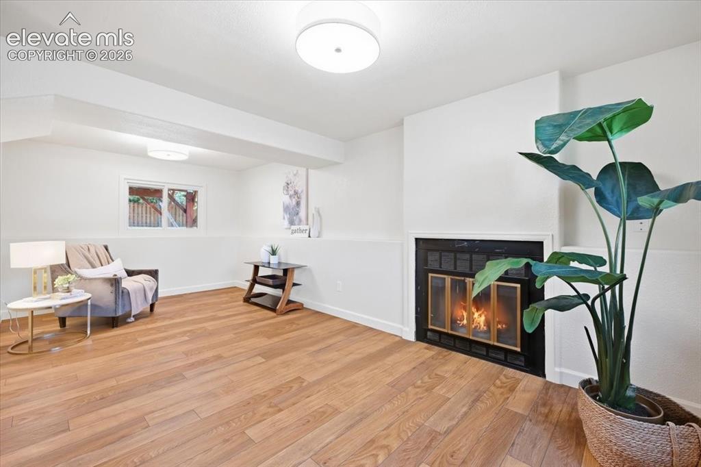 Image 23 of 32: Basement bedroom has fireplace and is so big it can be a sitting area!