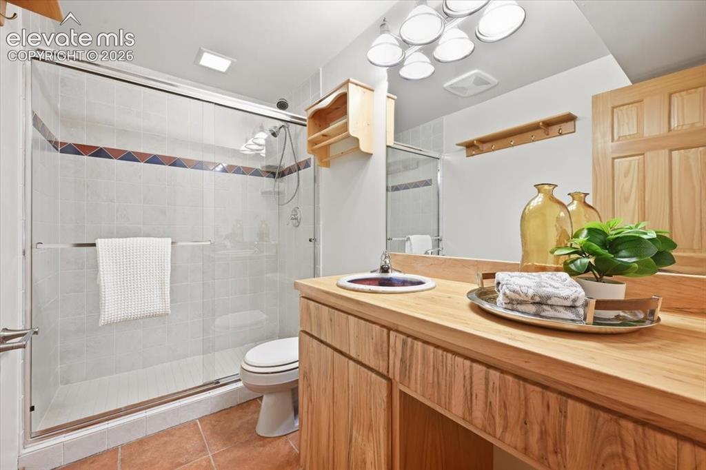 Image 25 of 32: Charming basement bath with custom sink!