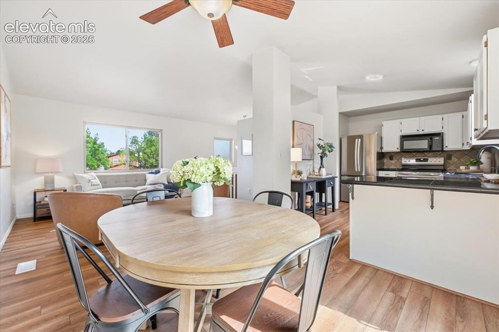 Image 9 of 32: Dining area opens to the family room for easy living!
