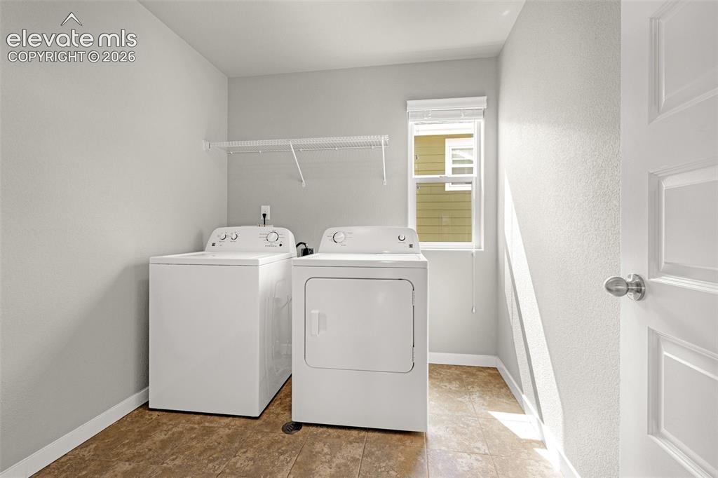 Image 22 of 44: Utility room with durable flooring, a single window, and a built-in wire sh