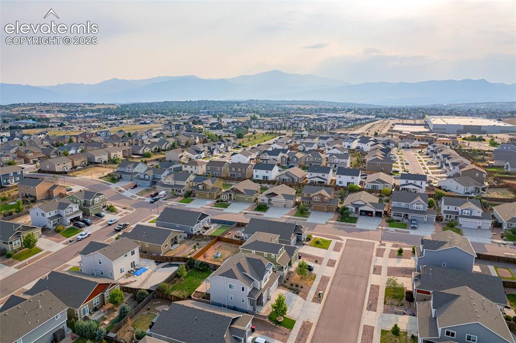 Image 42 of 44: Expansive residential neighborhood with varied architectural styles and mou