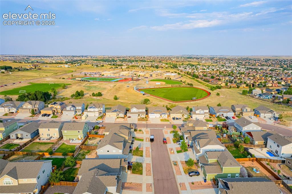 Image 43 of 44: Residential development with varied architectural styles and integrated ope