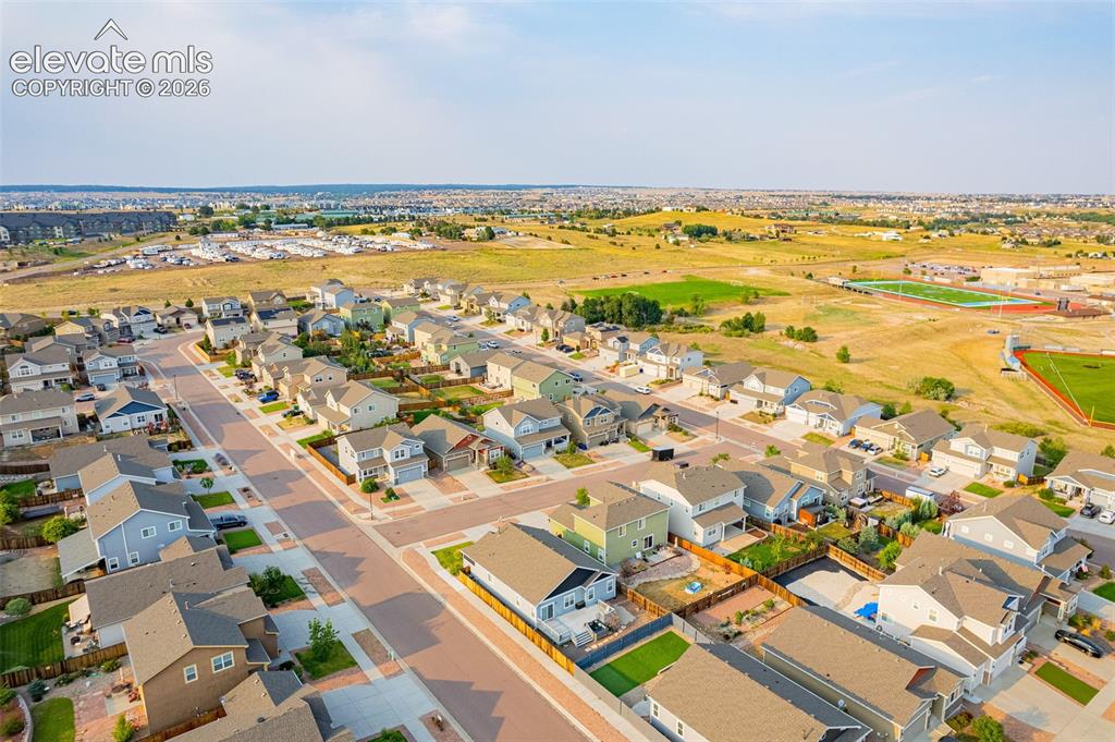 Image 44 of 44: Aerial depiction of a residential neighborhood with varied home styles, pav