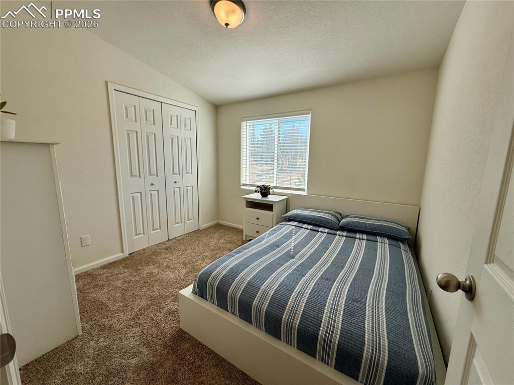 Image 22 of 50: Upper level Bedroom 