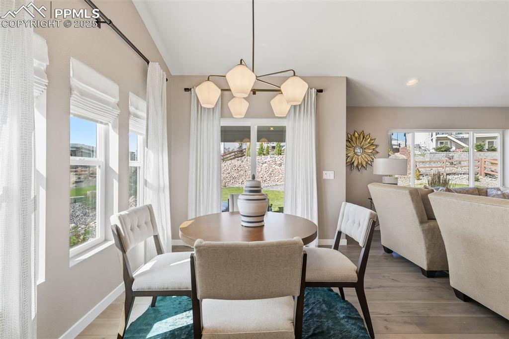 Image 23 of 49: Dining area walks out to covered back patio 