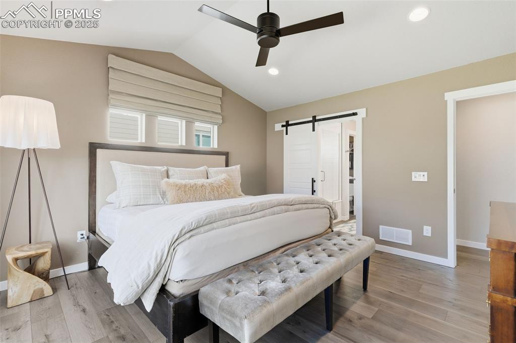 Image 28 of 49: Remote controlled Roman shades and walk-in closet