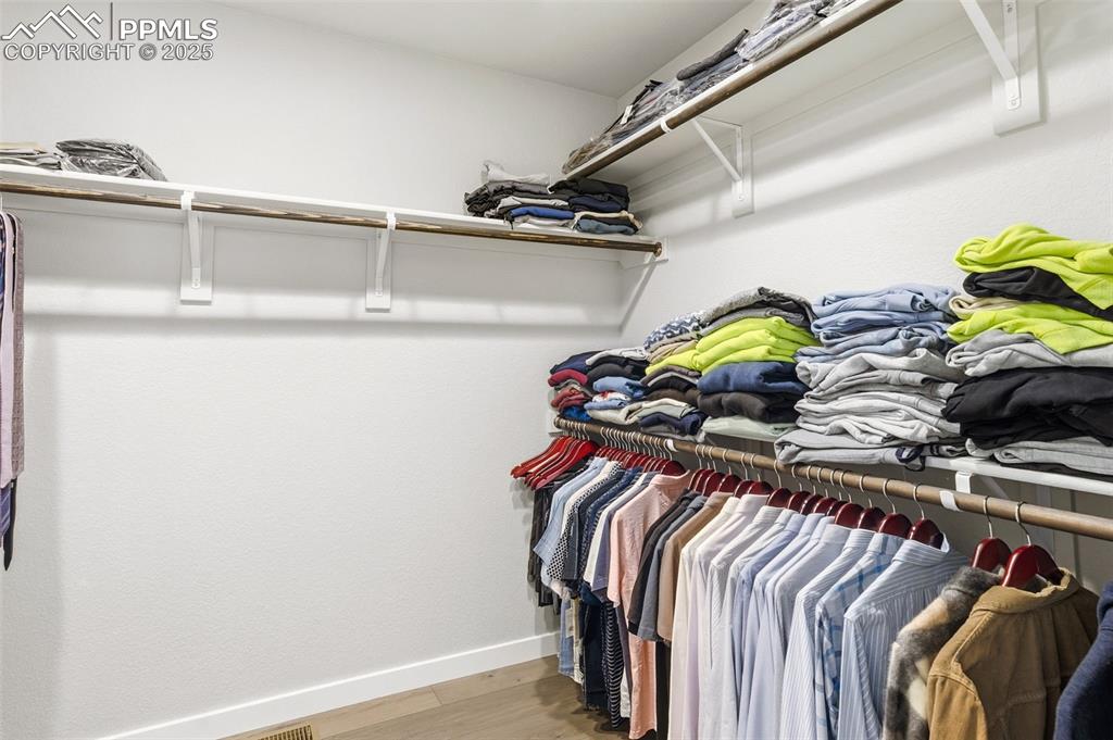 Image 31 of 49: Large walk-in closet in Primary bedroom