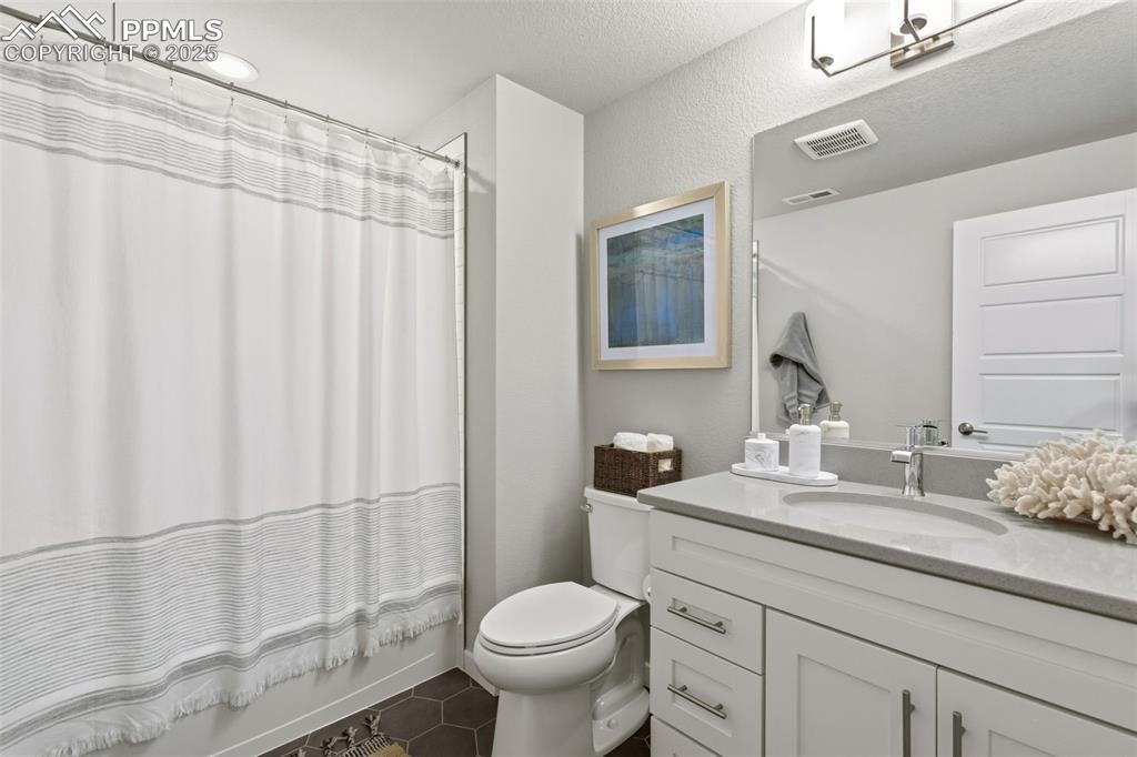 Image 38 of 49: Basement bath services both bedrooms