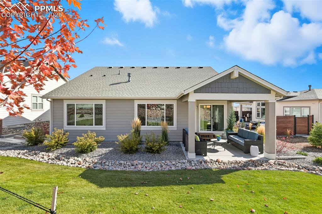 Image 41 of 49: Covered back patio off dining area