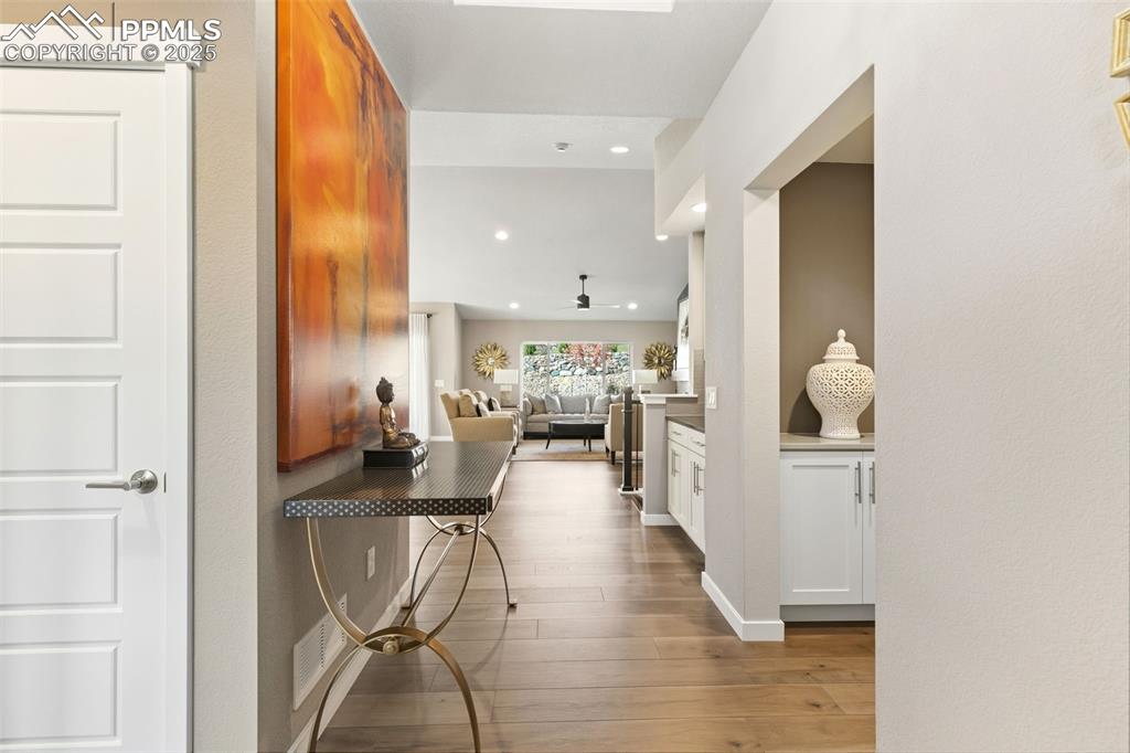 Image 7 of 49: Open concept main level featuring luxury vinyl plan flooring