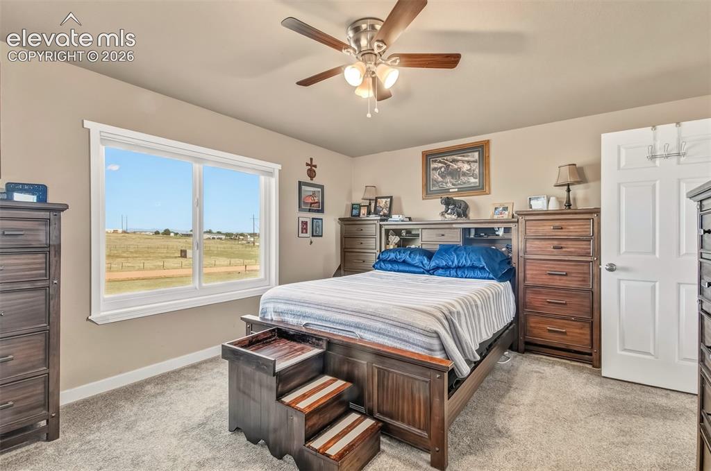 Image 14 of 43: Spacious bedroom with walk-in closet, opens to a private, ensuite 5 piece m