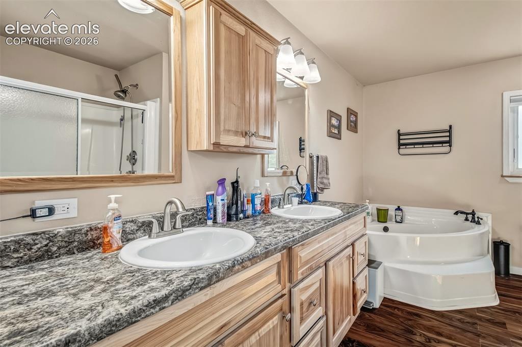 Image 16 of 43: Lovely master bathroom, soaking tub, double sinks. Not shown in this photo,