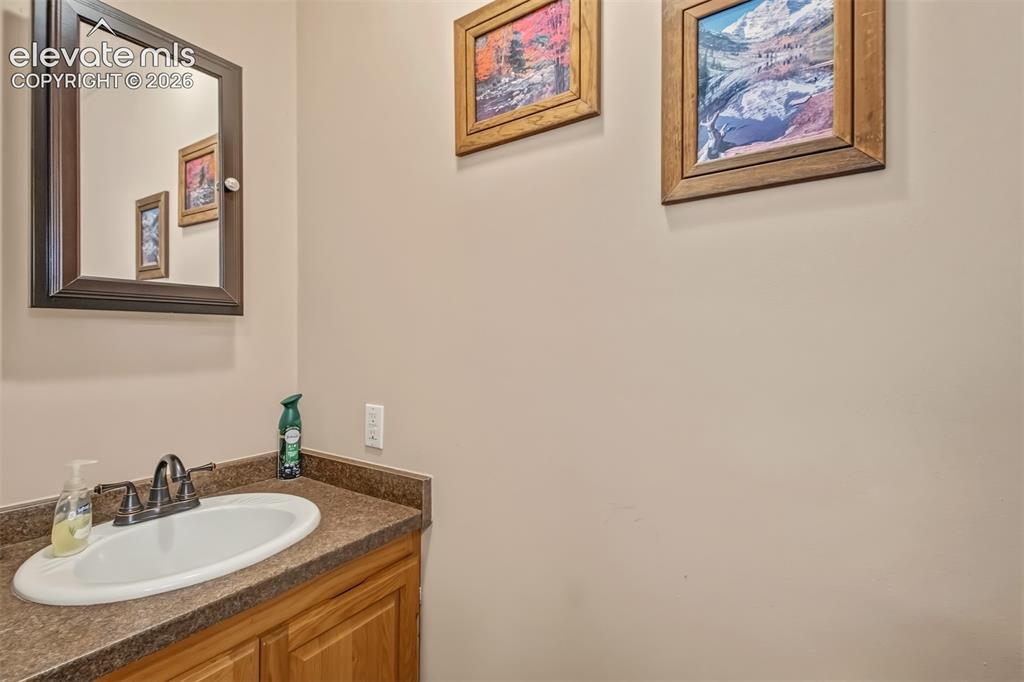 Image 22 of 43: Guest half bathroom.