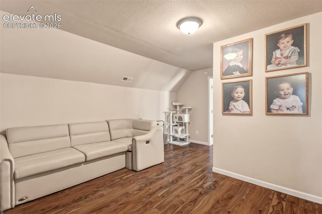 Image 25 of 43: Upper level loft, it would be great as a recreation/family room, play area