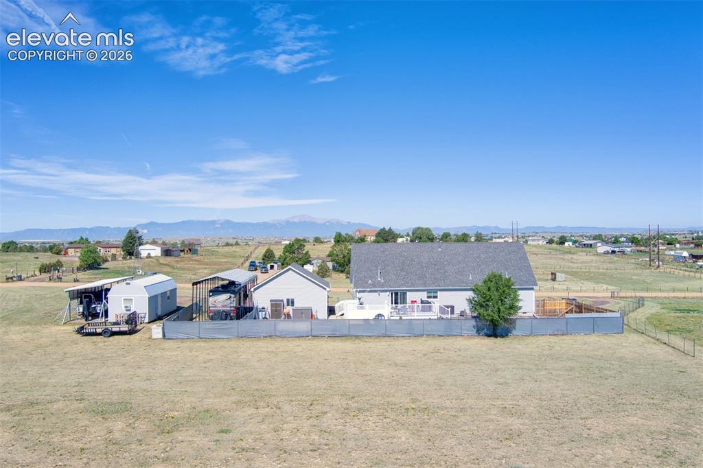 Image 3 of 43: Great views of Pikes Peak and the front range. Fenced pasture area to the r