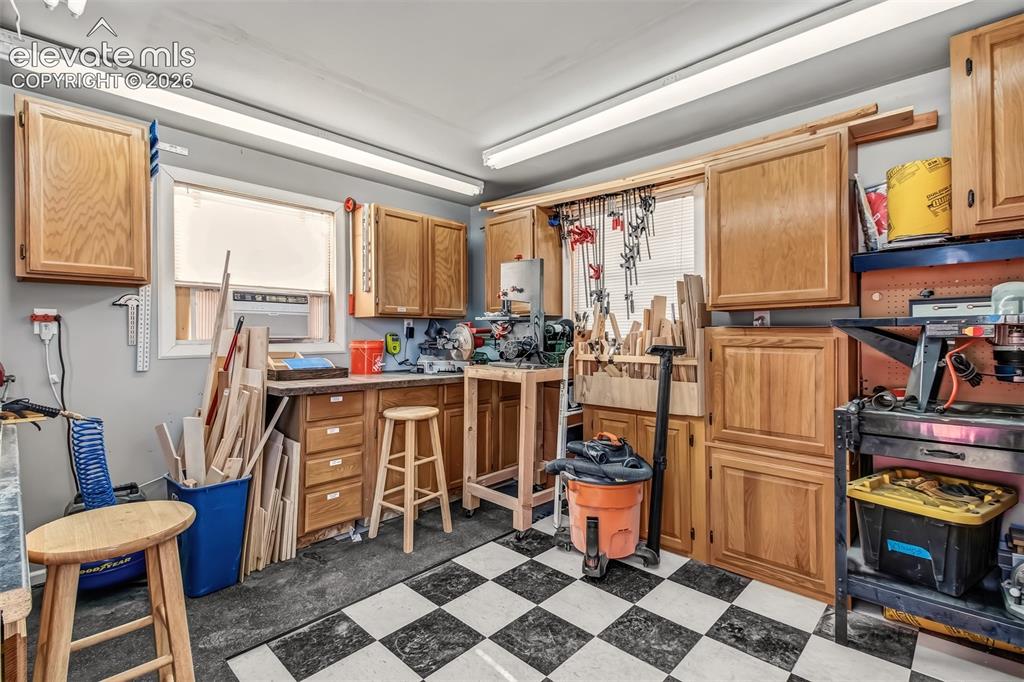 Image 35 of 43: This is the workshop partitioned off in the 32x12 Weather King garage works