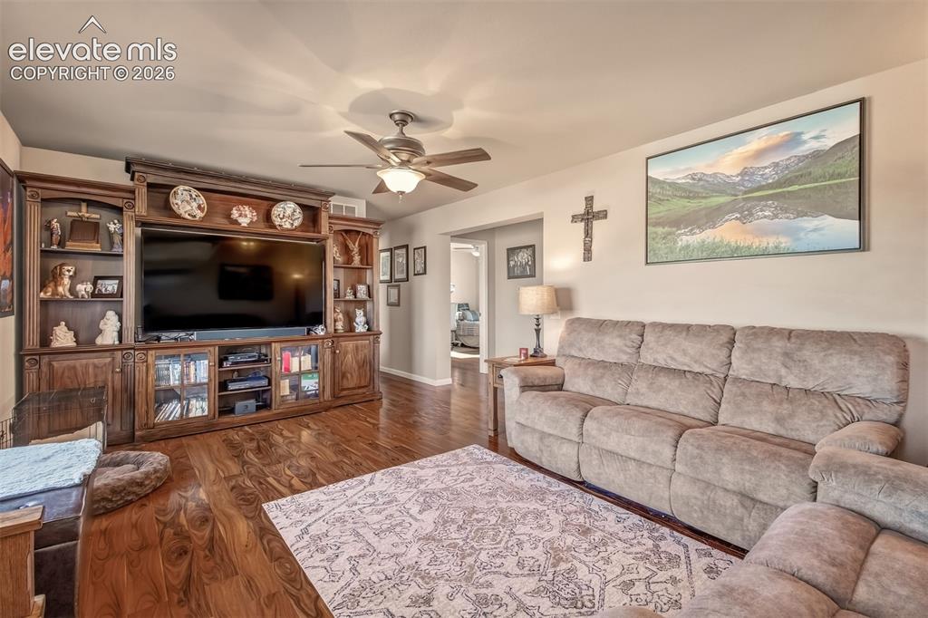 Image 4 of 43: Gorgeous wood laminate floors, yes, the wall unit or the shrunk will fit!
