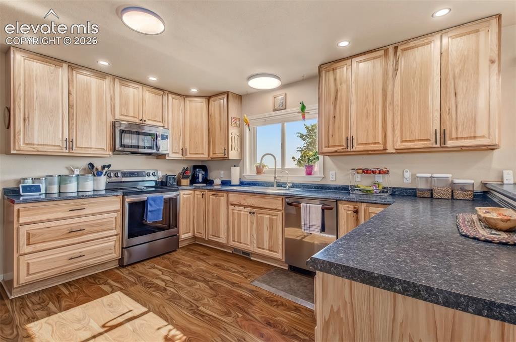 Image 7 of 43: Ample countertop prep space, thoughtful design.