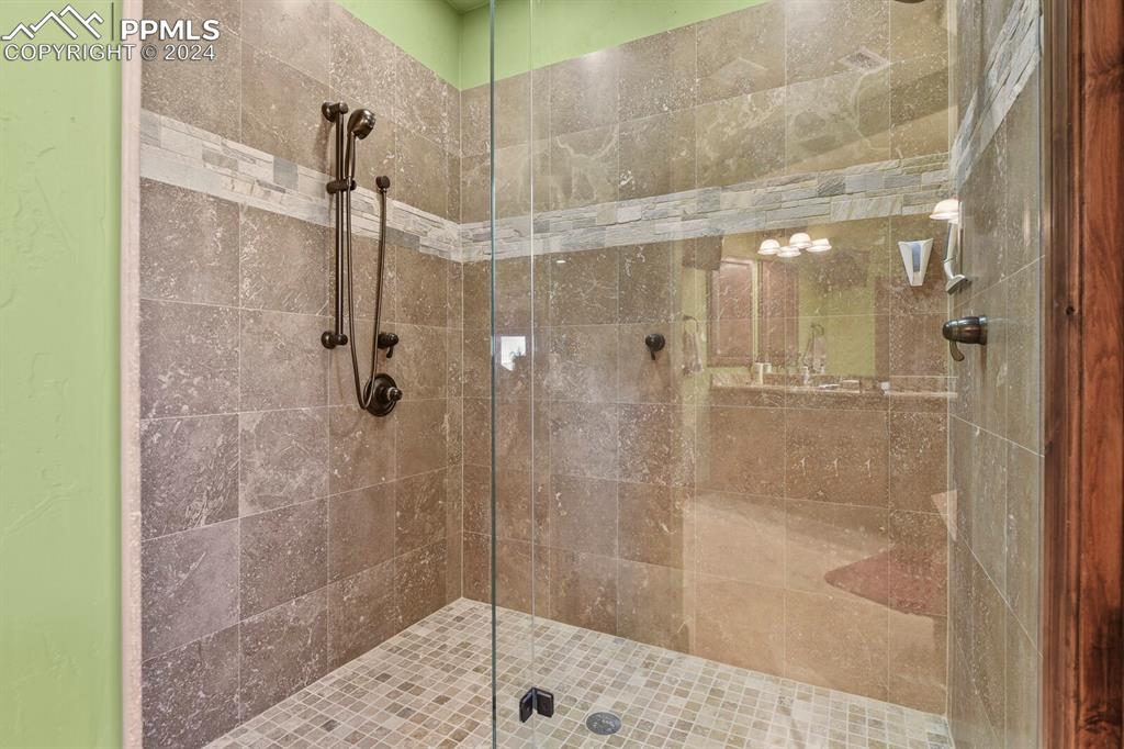 Image 23 of 50: Bathroom featuring an enclosed shower