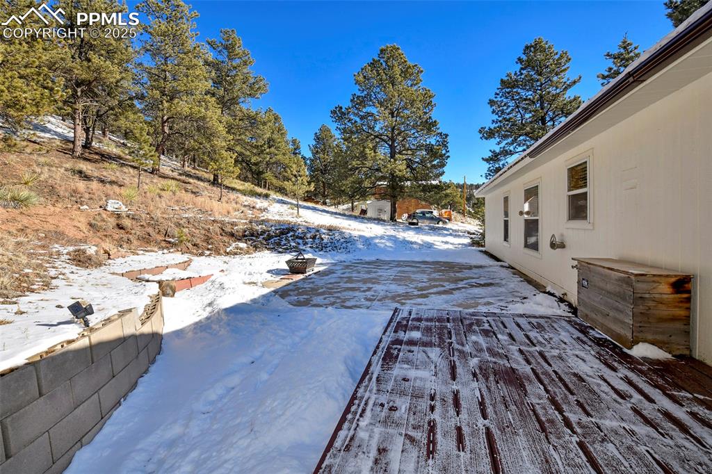Image 12 of 29: Snow covered Decking off Laundry and Kitchen  