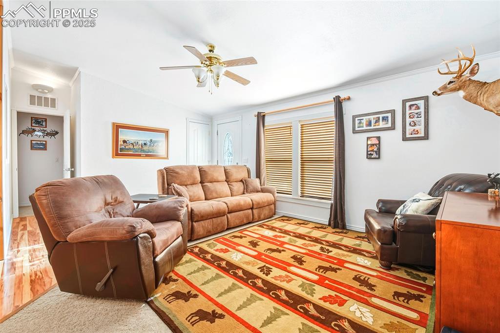 Image 14 of 29: Living Room, Front Entry and Hall to 2nd Master Suite with Large Bathroom a
