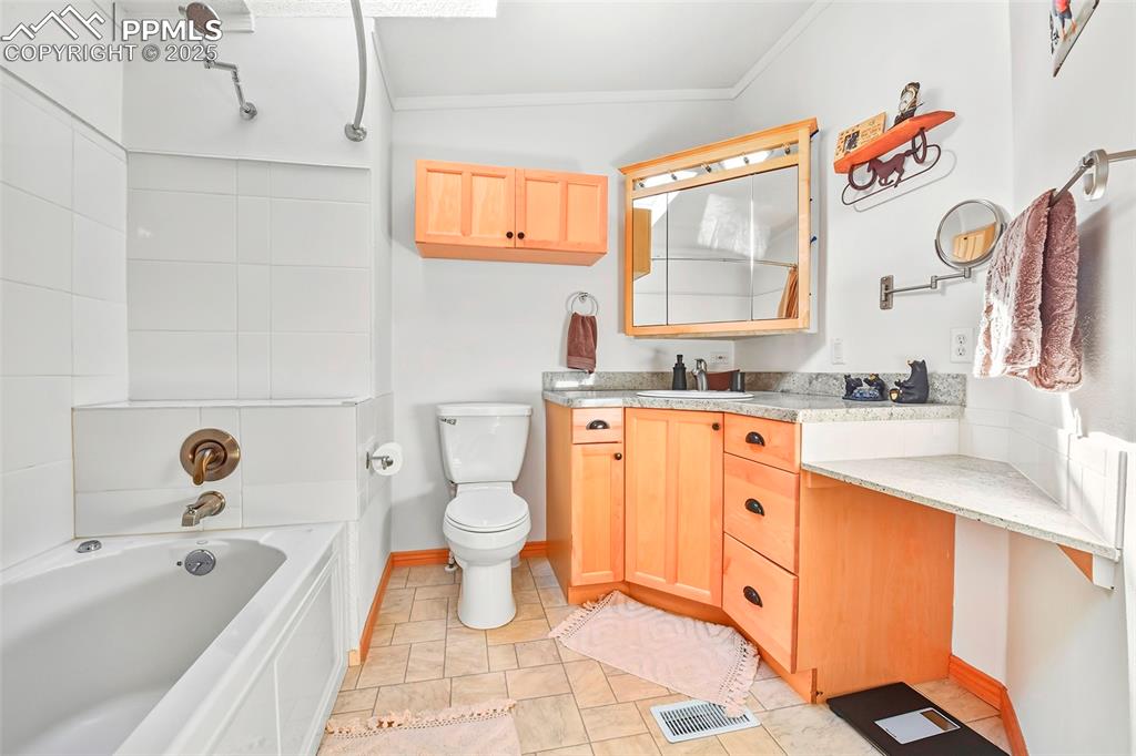Image 27 of 29: 2nd Master Suite Bathroom with Extra Counter Space and Cabinets