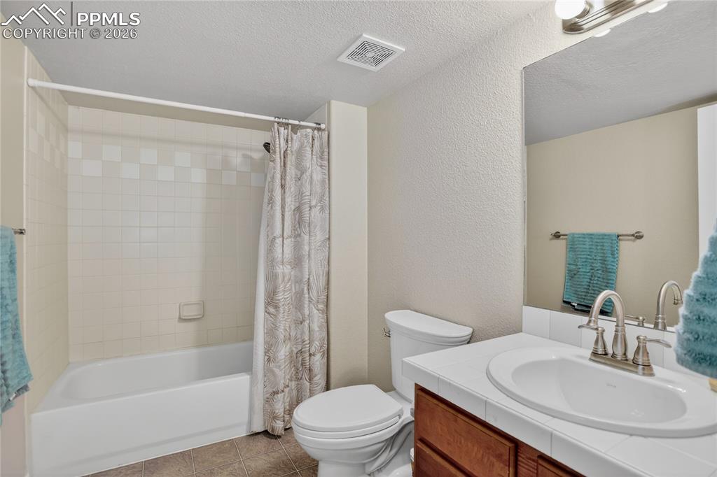 Image 21 of 25: Full guest bath - lower level