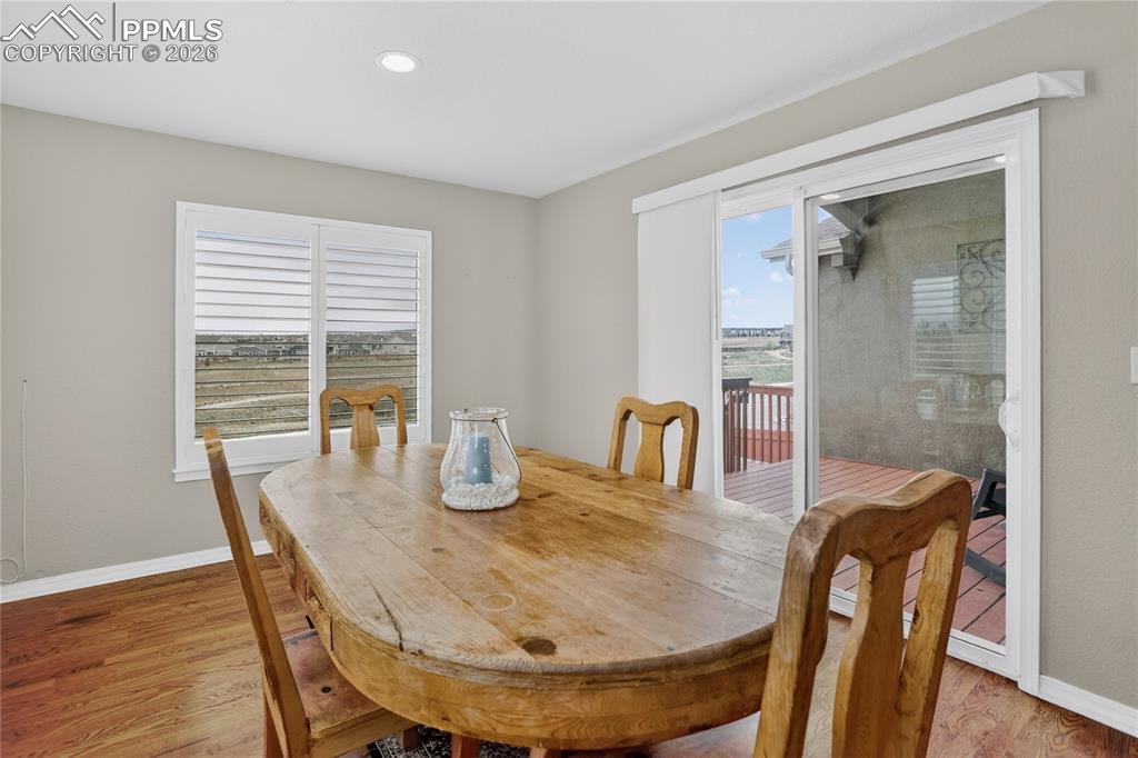 Image 7 of 25: Dining area w/ walk-out