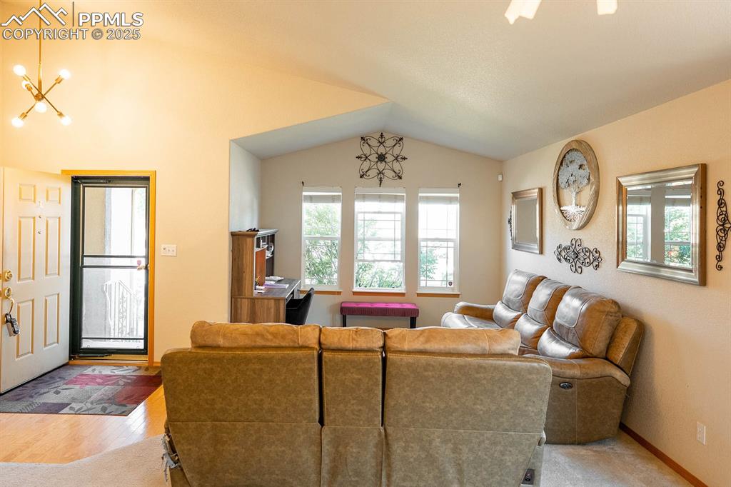 Image 3 of 37: Vaulted ceilings at the front of the home.